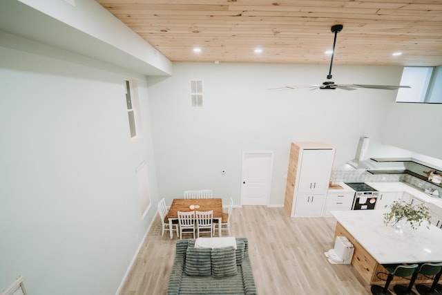interior space featuring light wood finished floors, wooden ceiling, recessed lighting, and ceiling fan