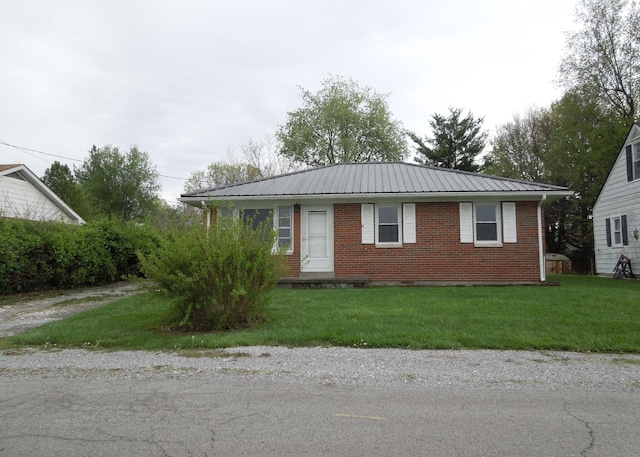 217 Dorothy Ave, Danville, KY 40422 - view of front of property featuring brick siding, a front yard, and metal roof