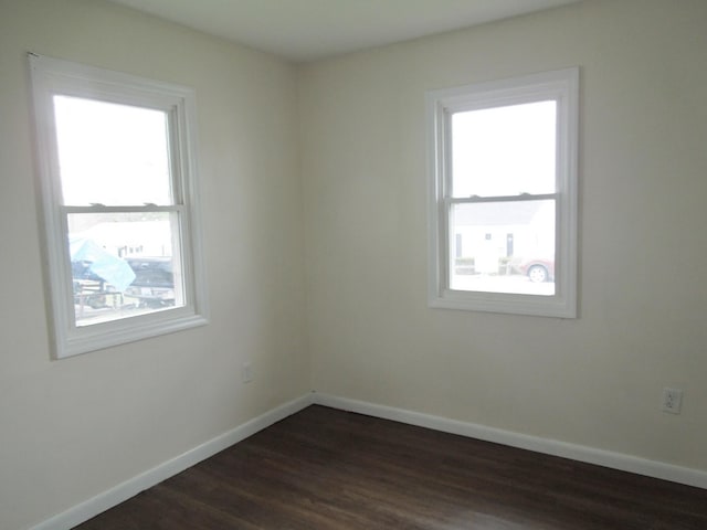 217 Dorothy Ave, Danville, KY 40422 - unfurnished room featuring a healthy amount of sunlight, baseboards, and dark wood-style flooring