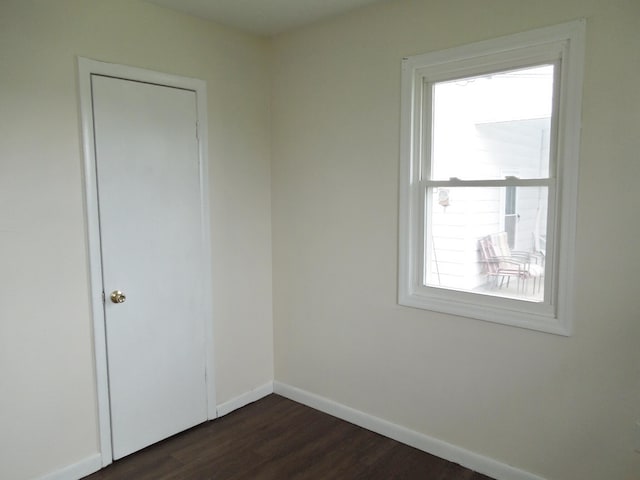 217 Dorothy Ave, Danville, KY 40422 - unfurnished room featuring dark wood finished floors, a wealth of natural light, and baseboards