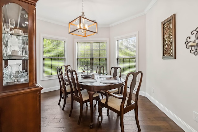 600 Avawam Dr, Richmond, KY 40475 - dining area with crown molding, dark wood-style floors, a chandelier, and baseboards