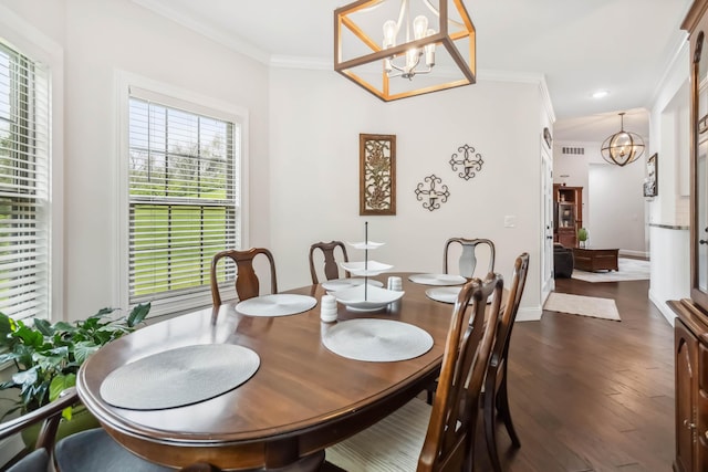 600 Avawam Dr, Richmond, KY 40475 - dining space featuring crown molding, dark wood finished floors, a notable chandelier, and plenty of natural light