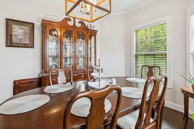 600 Avawam Dr, Richmond, KY 40475 - dining space with baseboards, ornamental molding, an inviting chandelier, and dark wood-style floors