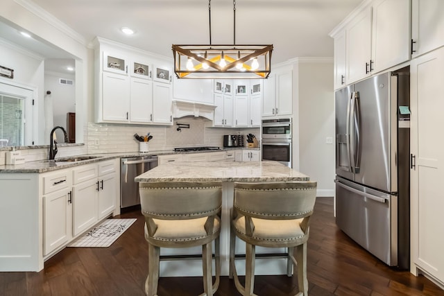 600 Avawam Dr, Richmond, KY 40475 - kitchen with tasteful backsplash, visible vents, stainless steel appliances, a center island, and dark wood-type flooring
