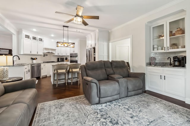 600 Avawam Dr, Richmond, KY 40475 - living area featuring dark wood-type flooring, crown molding, recessed lighting, and ceiling fan with notable chandelier