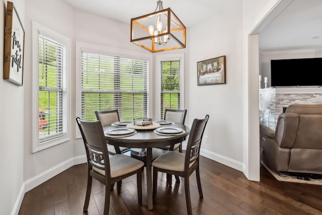 600 Avawam Dr, Richmond, KY 40475 - dining space featuring an inviting chandelier, dark wood-style flooring, plenty of natural light, and baseboards