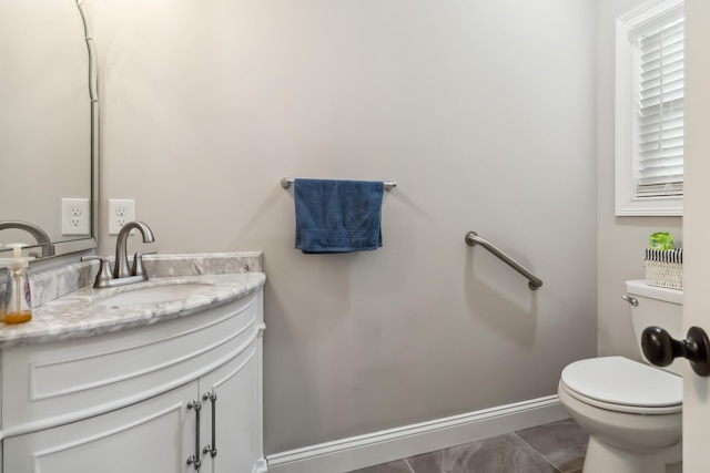 600 Avawam Dr, Richmond, KY 40475 - bathroom with vanity, toilet, marble finish floor, and baseboards