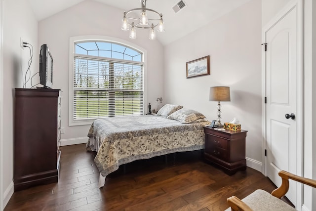 600 Avawam Dr, Richmond, KY 40475 - bedroom with lofted ceiling, visible vents, baseboards, dark wood-type flooring, and a notable chandelier