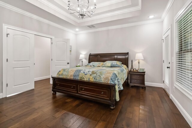600 Avawam Dr, Richmond, KY 40475 - bedroom featuring baseboards, ornamental molding, dark wood-style flooring, and a tray ceiling
