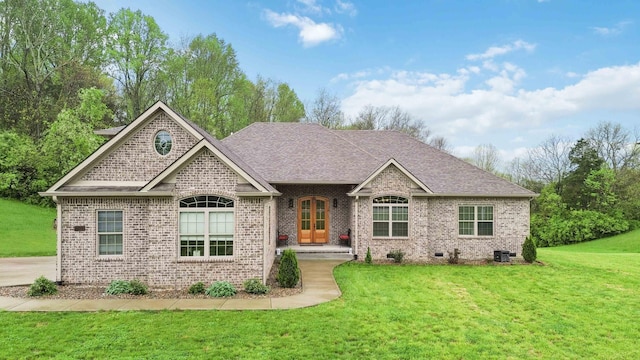 600 Avawam Dr, Richmond, KY 40475 - view of front facade featuring a shingled roof, brick siding, and a front lawn