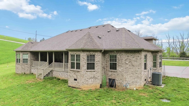 600 Avawam Dr, Richmond, KY 40475 - back of property featuring brick siding, central AC unit, a yard, and a sunroom