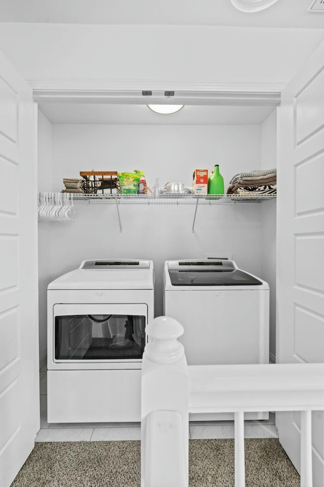 laundry area with tile patterned floors, laundry area, and independent washer and dryer