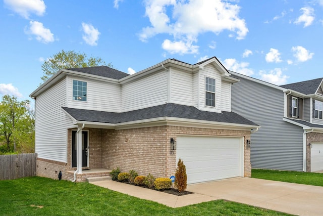 traditional-style house with a front lawn, concrete driveway, fence, a garage, and brick siding