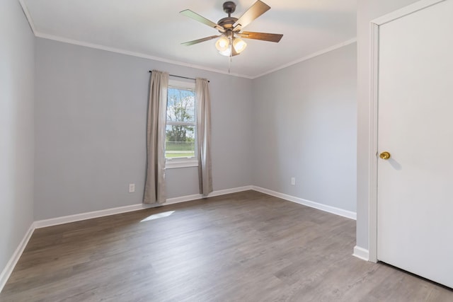679 Mclain Rd, Springfield, KY 40069 - spare room with a ceiling fan, baseboards, ornamental molding, and wood finished floors