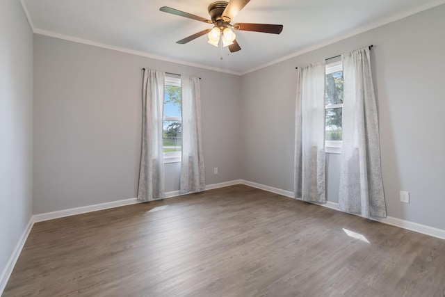 679 Mclain Rd, Springfield, KY 40069 - empty room featuring wood finished floors, crown molding, baseboards, and a ceiling fan