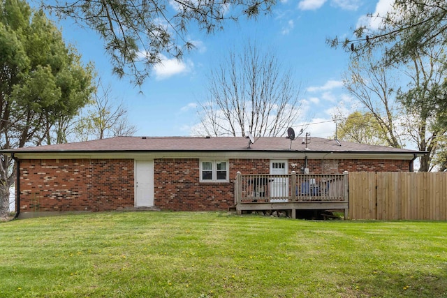 679 Mclain Rd, Springfield, KY 40069 - rear view of property with fence, a wooden deck, brick siding, and a yard