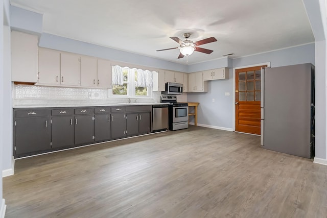 679 Mclain Rd, Springfield, KY 40069 - kitchen with baseboards, a ceiling fan, stainless steel appliances, and light countertops