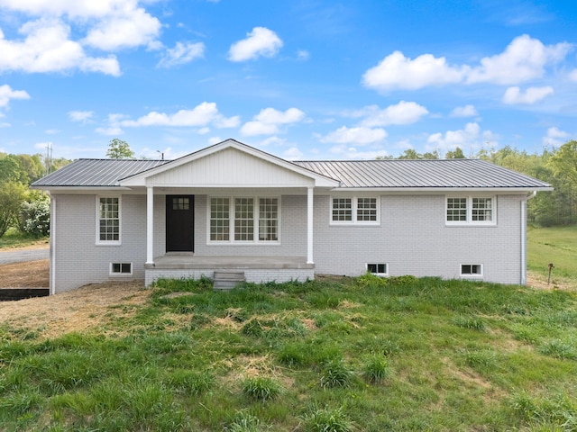 827 Pine Hill Brock Rd, London, KY 40741 - view of front of house with covered porch, metal roof, and brick siding