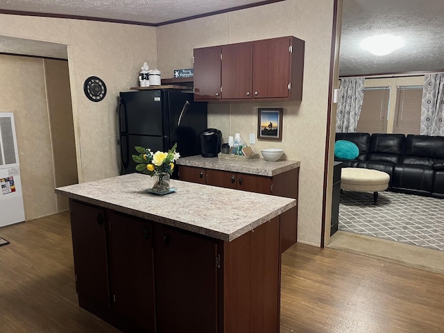 501 Smith Rd, Manchester, KY 40962 - kitchen featuring dark wood finished floors, a textured wall, a textured ceiling, and freestanding refrigerator