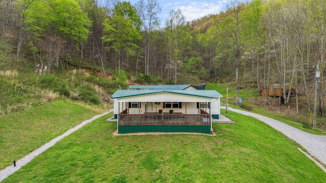 501 Smith Rd, Manchester, KY 40962 - exterior space with a forest view, driveway, covered porch, a yard, and metal roof