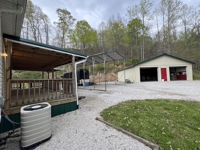 501 Smith Rd, Manchester, KY 40962 - exterior space featuring central AC unit, an outbuilding, and a garage