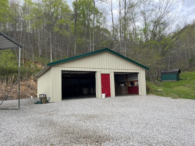 501 Smith Rd, Manchester, KY 40962 - detached garage featuring a view of trees