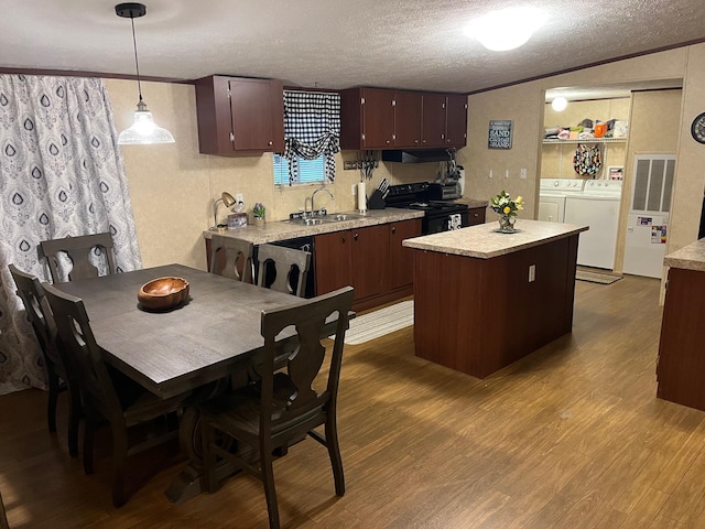 501 Smith Rd, Manchester, KY 40962 - kitchen featuring washing machine and dryer, light countertops, a sink, and black electric range