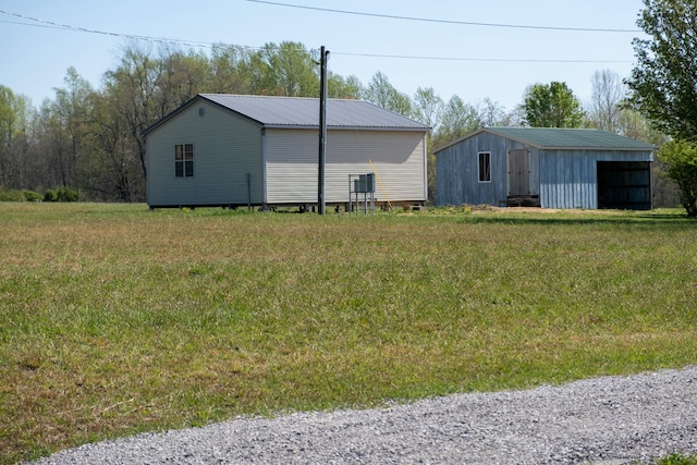 view of pole building with a yard
