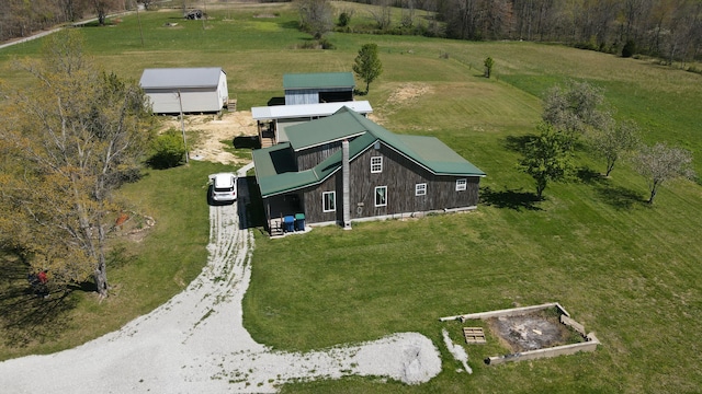 birds eye view of property with a rural view