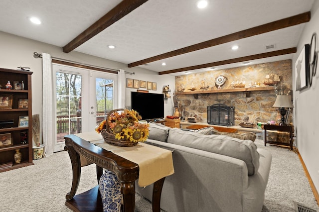 carpeted living area with recessed lighting, visible vents, and french doors