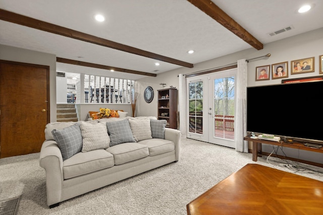 carpeted living area with visible vents, beamed ceiling, and recessed lighting
