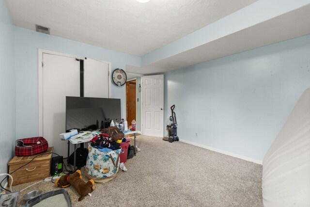 playroom featuring baseboards, carpet flooring, and visible vents