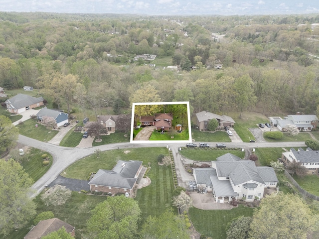 bird's eye view with a view of trees and a residential view
