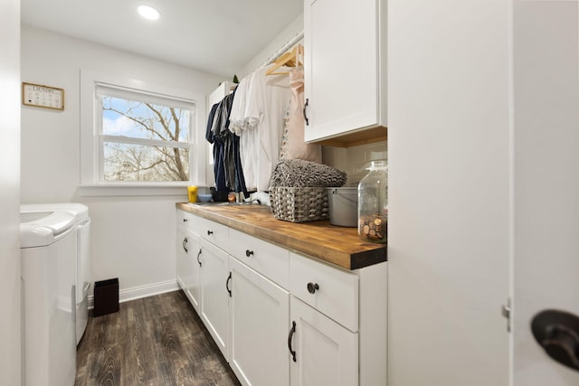 washroom with independent washer and dryer, cabinet space, baseboards, dark wood-type flooring, and recessed lighting