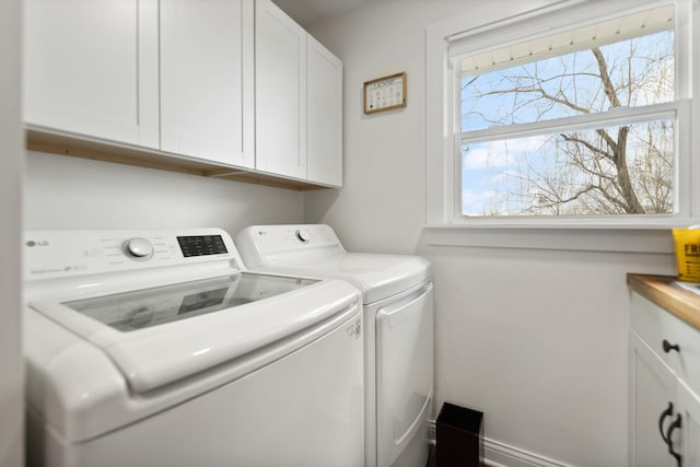 laundry room featuring cabinet space and washing machine and dryer