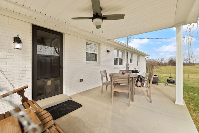 view of patio / terrace with outdoor dining space and a ceiling fan