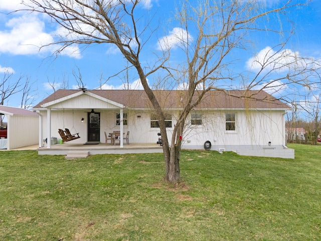 back of house featuring a yard, crawl space, and a shingled roof
