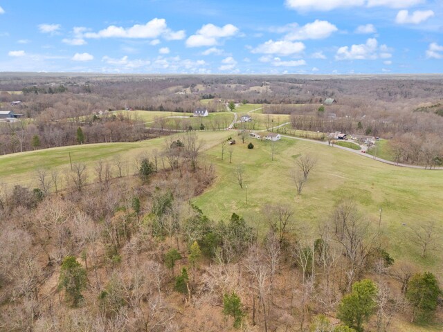 birds eye view of property featuring a rural view
