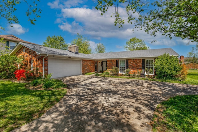 3205 Pontchartrain Ct, Lexington, KY 40515 - ranch-style house featuring a garage, a front yard, driveway, and brick siding