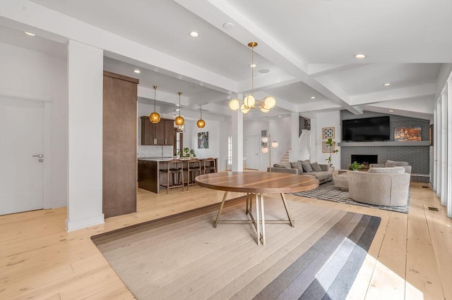 813 Westchester Dr, Lexington, KY 40502 - living area featuring light wood-style flooring, beam ceiling, recessed lighting, coffered ceiling, and a brick fireplace