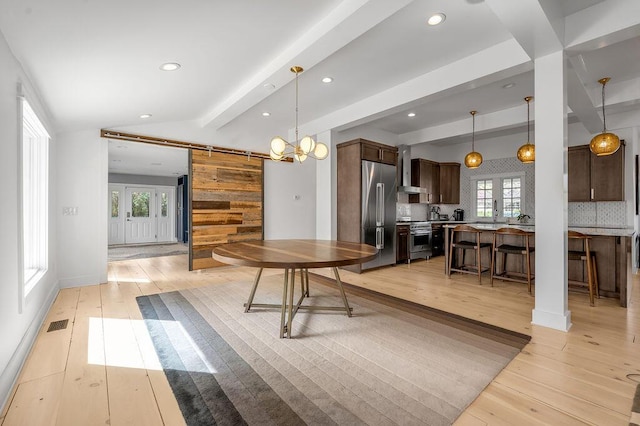 813 Westchester Dr, Lexington, KY 40502 - dining area featuring lofted ceiling with beams, light wood-style flooring, a barn door, visible vents, and recessed lighting
