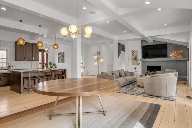813 Westchester Dr, Lexington, KY 40502 - living area featuring stairway, coffered ceiling, beam ceiling, light wood-style flooring, and a brick fireplace