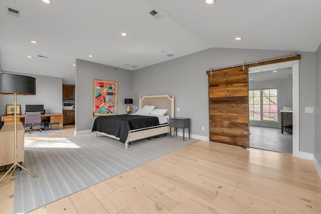 813 Westchester Dr, Lexington, KY 40502 - bedroom featuring wood finished floors, visible vents, recessed lighting, and a barn door