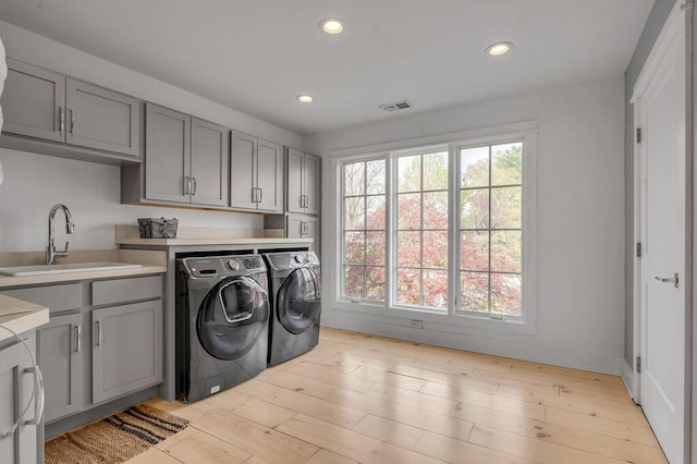 813 Westchester Dr, Lexington, KY 40502 - laundry area featuring a sink, washing machine and dryer, visible vents, recessed lighting, and cabinet space