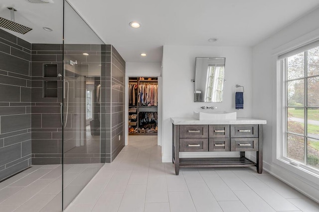 813 Westchester Dr, Lexington, KY 40502 - full bath with a spacious closet, a tile shower, vanity, and recessed lighting