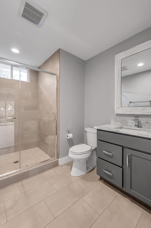 813 Westchester Dr, Lexington, KY 40502 - bathroom featuring a shower stall, vanity, toilet, visible vents, and recessed lighting