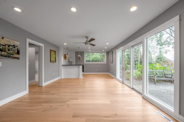 813 Westchester Dr, Lexington, KY 40502 - unfurnished living room featuring ceiling fan, light wood finished floors, baseboards, visible vents, and recessed lighting