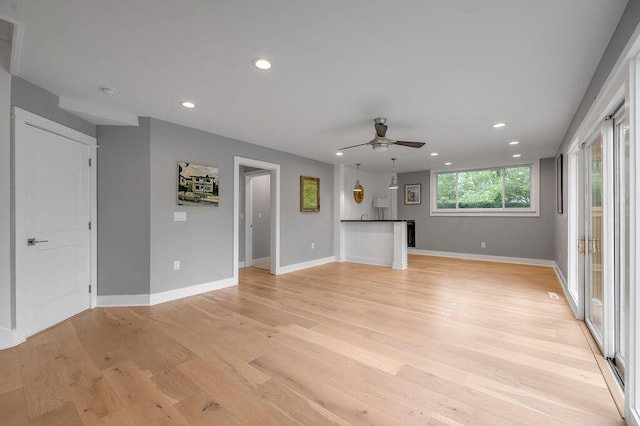 813 Westchester Dr, Lexington, KY 40502 - unfurnished living room featuring light wood-style flooring, baseboards, recessed lighting, and a ceiling fan