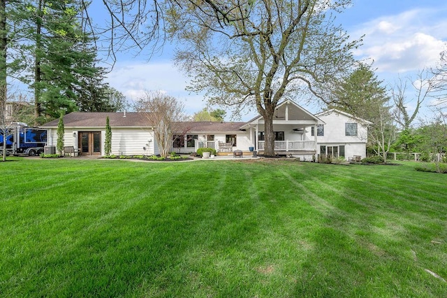 813 Westchester Dr, Lexington, KY 40502 - back of house featuring a lawn and fence
