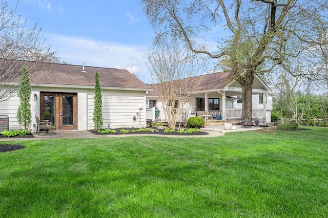 813 Westchester Dr, Lexington, KY 40502 - rear view of property featuring a lawn, french doors, and a patio